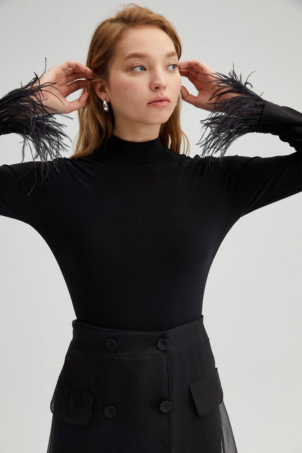 High-neck bodysuit with feather cuffs – elegant black