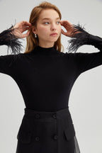 High-neck bodysuit with feather cuffs – elegant black