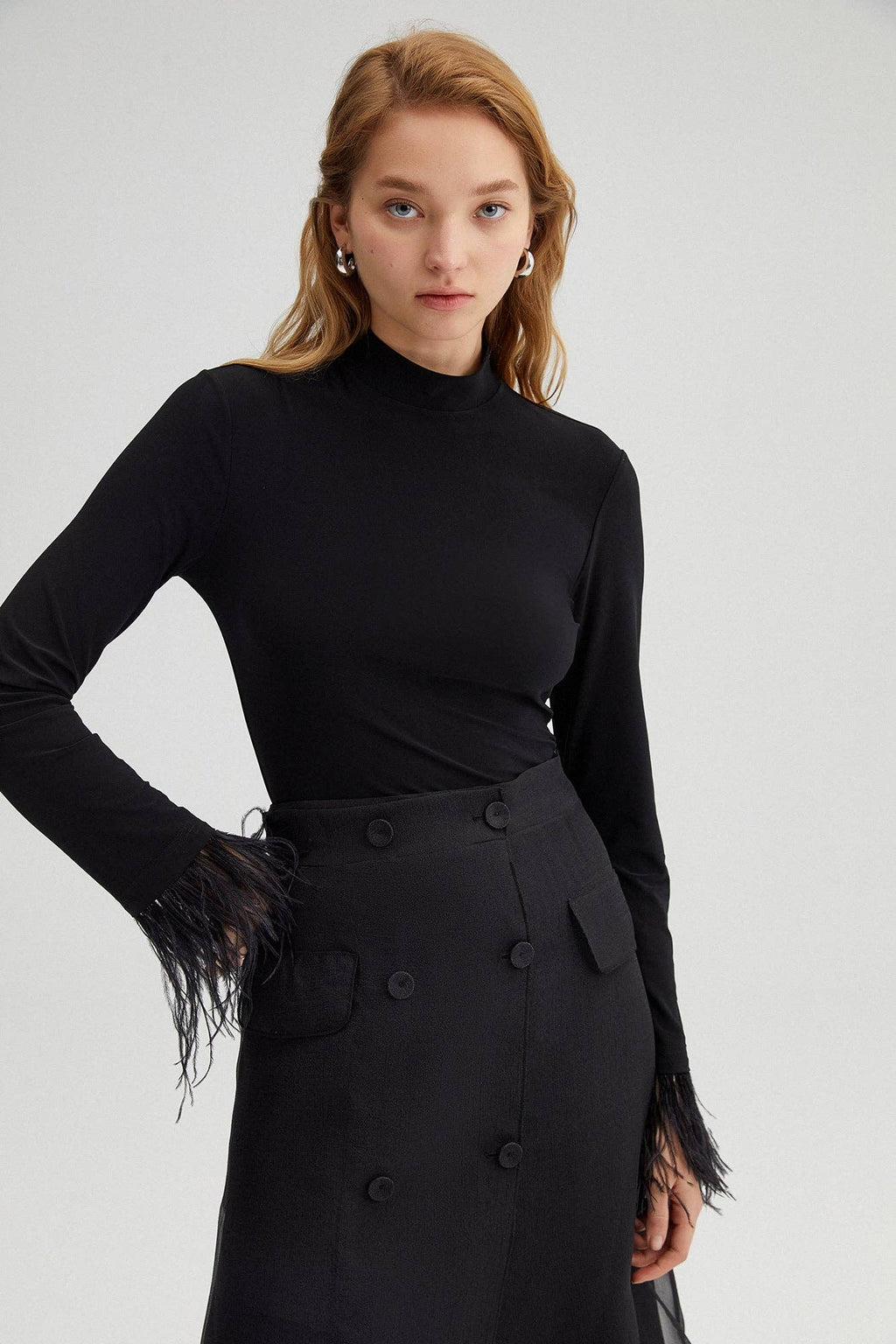 High-neck bodysuit with feather cuffs – elegant black