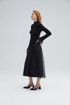 High-neck bodysuit with feather cuffs – elegant black