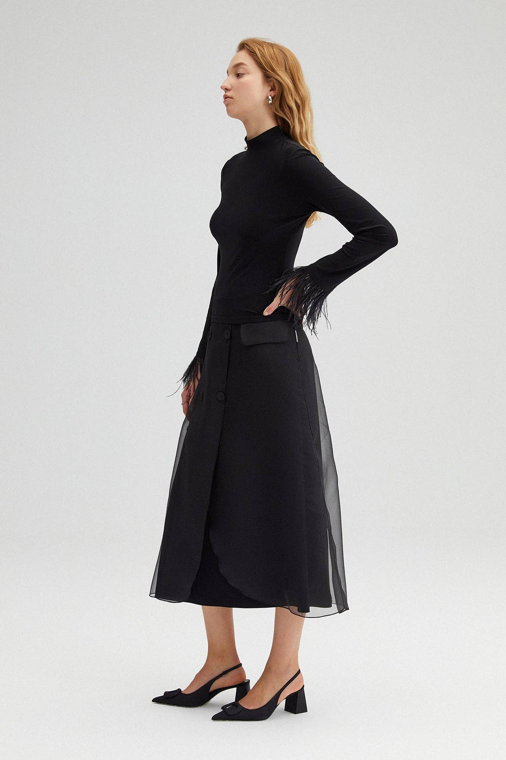 High-neck bodysuit with feather cuffs – elegant black